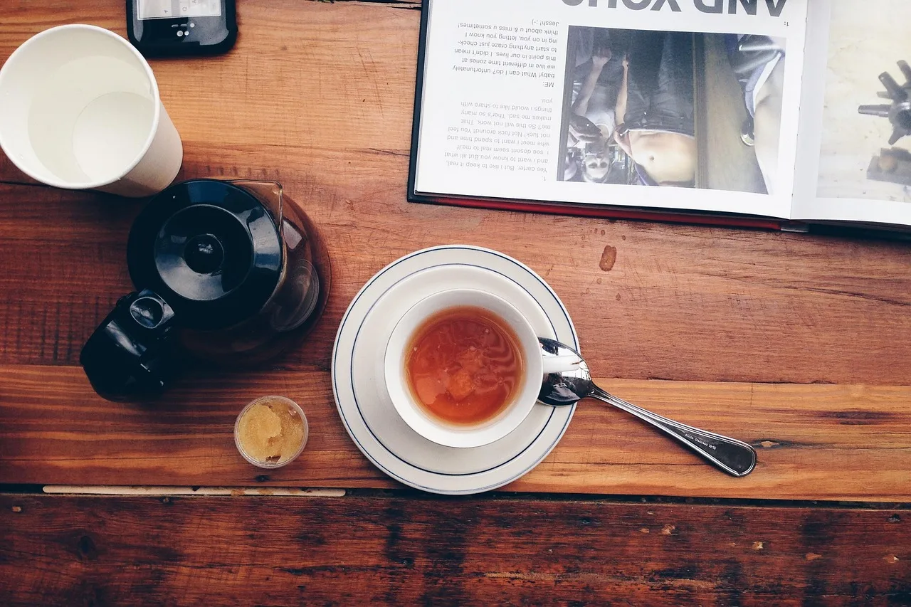 tea, tea cup, coffee, cup, wood, coffee cup, table, book, magazine. How UK magazine distribution works through Smiths News and Menzies
