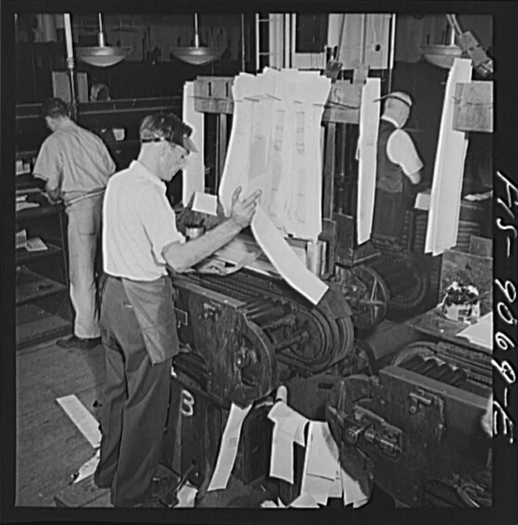 Composing room staff preparing newspaper proofs in 1942